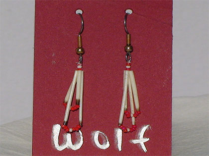 Two short quills and the two long quills all connected with White and Red size thirteen cut glass beads. Ear attachment is French Hooks